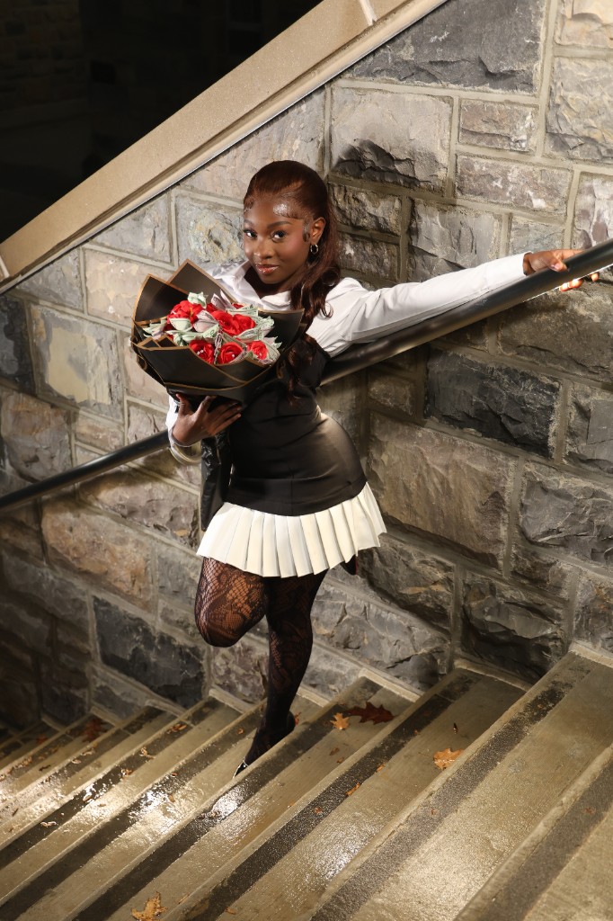 Portrait on stone staircase with roses