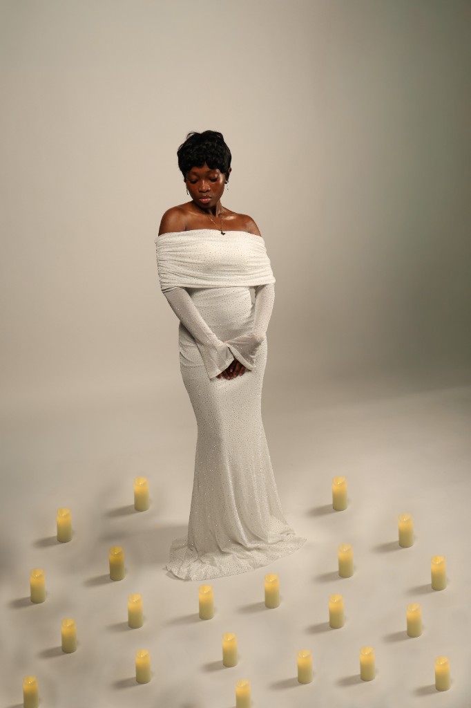 Studio portrait in white gown with candles
