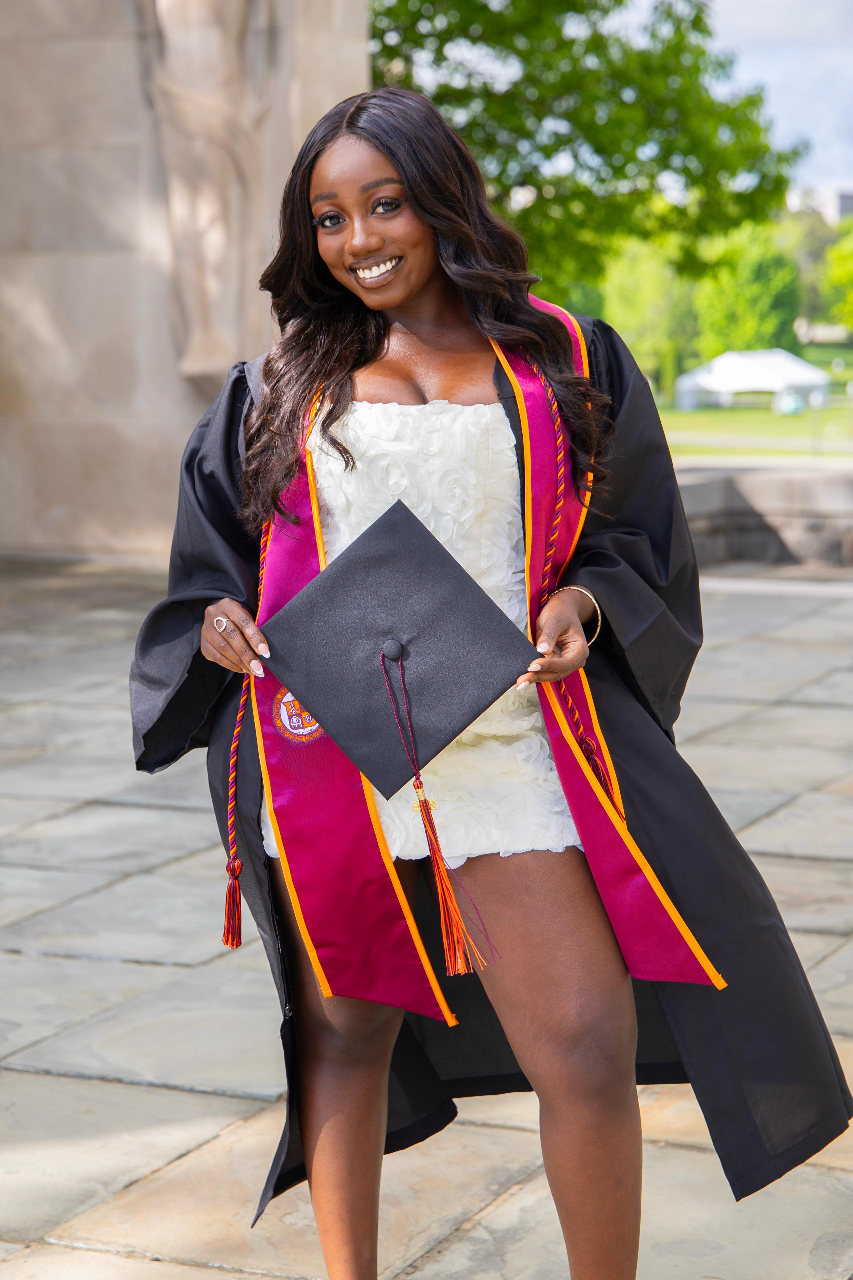 Graduate holding a cap during a Virginia Tech graduation session